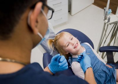 dr-nishant-with-child-patient-cosmetic-dentist-warrnambool
